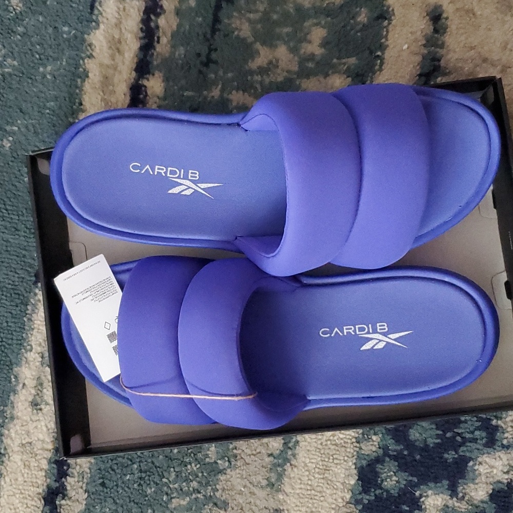 Carbi B Reebok Slides